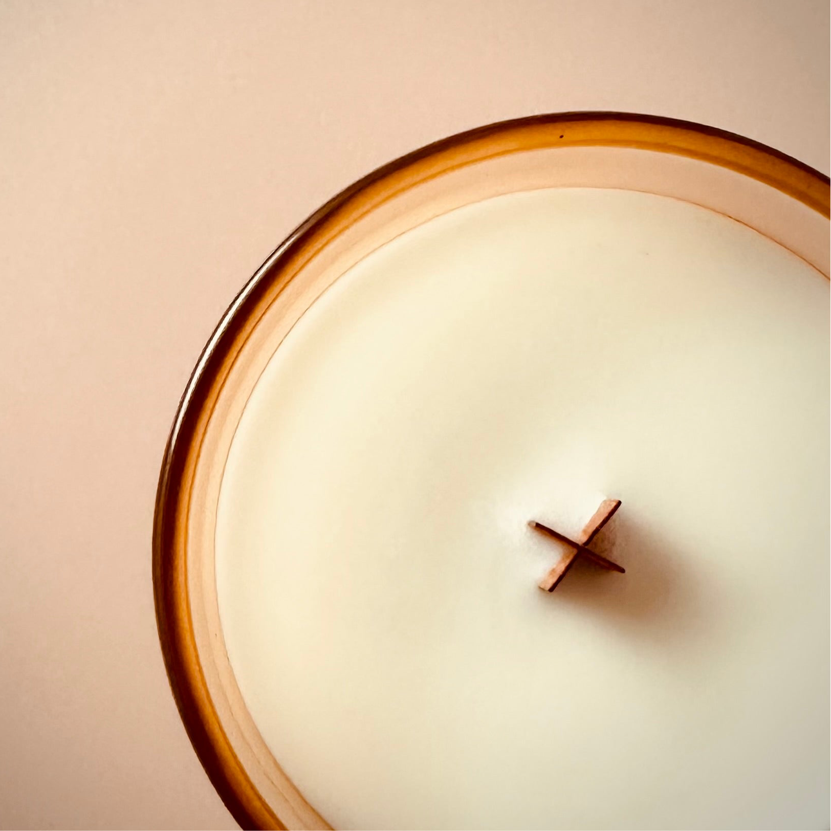 An image taken looking down at our 8oz Roads Scented candle to highlight the X shaped wooden wick.