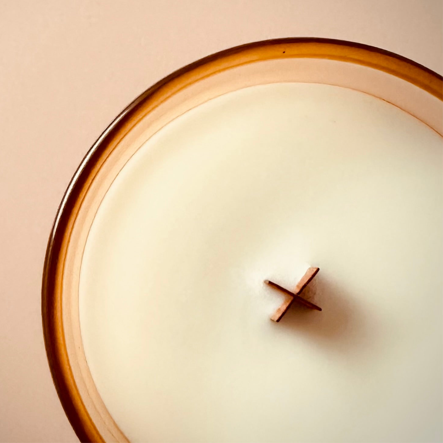 An image taken from above our 8oz Sundays scented candle. It highlights the X shaped Wooden wick.