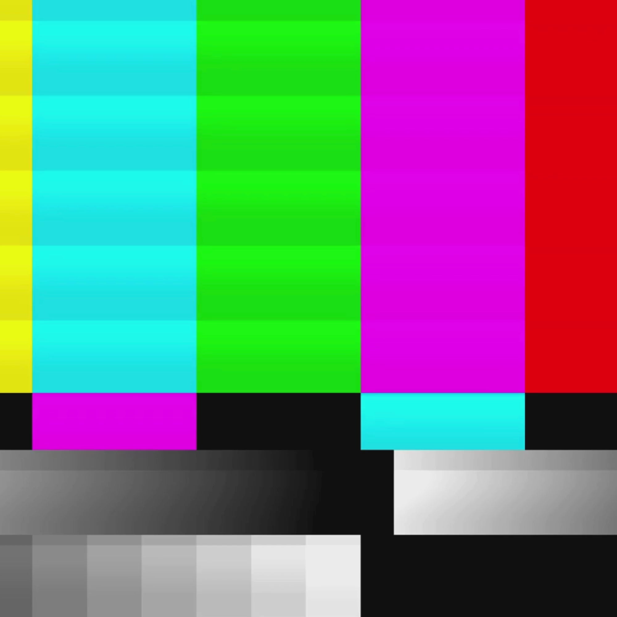 A short 5 second looping video with no volume. The vidoe depicts bright and colorful retro TV graphic for 'no signal' that slowly changes to black & white. The mood is retro & nolstalgic.