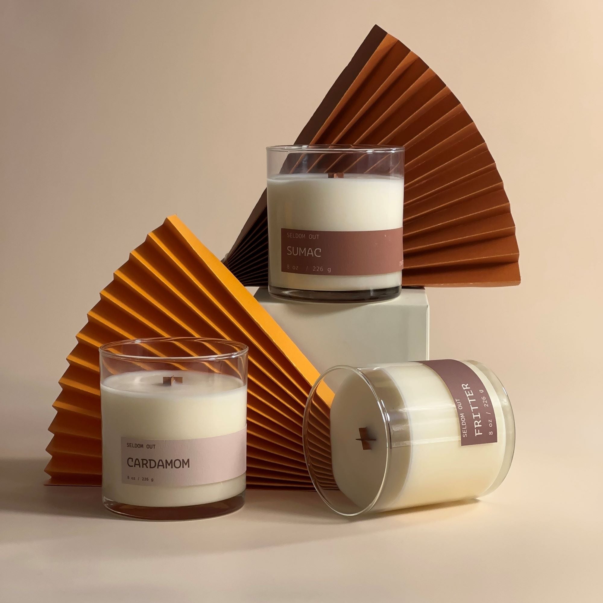 A studio style image featuring a trio of 8oz scented candles. 